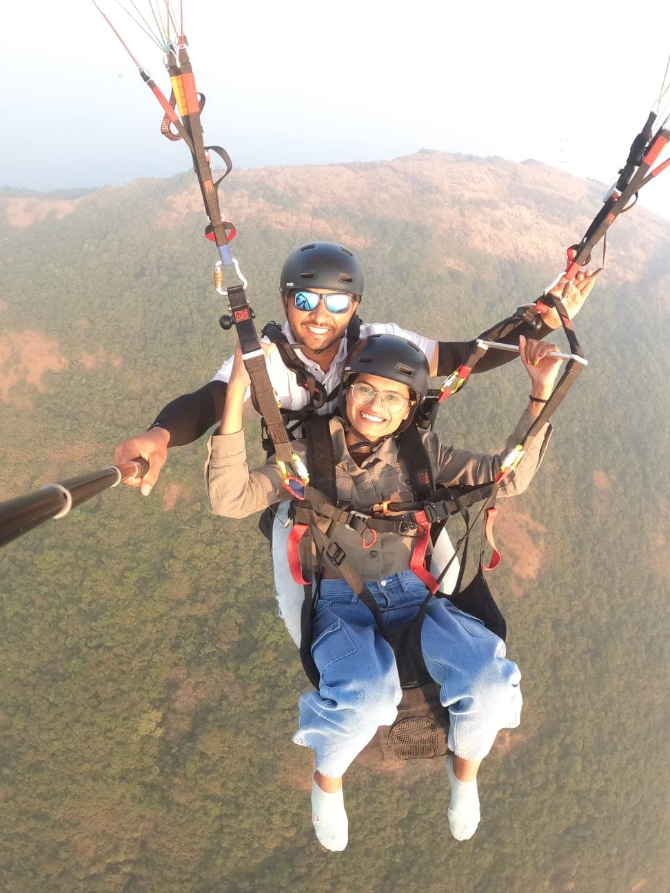 Acro paragliding maneuver with spiral dive over Kamshet valley