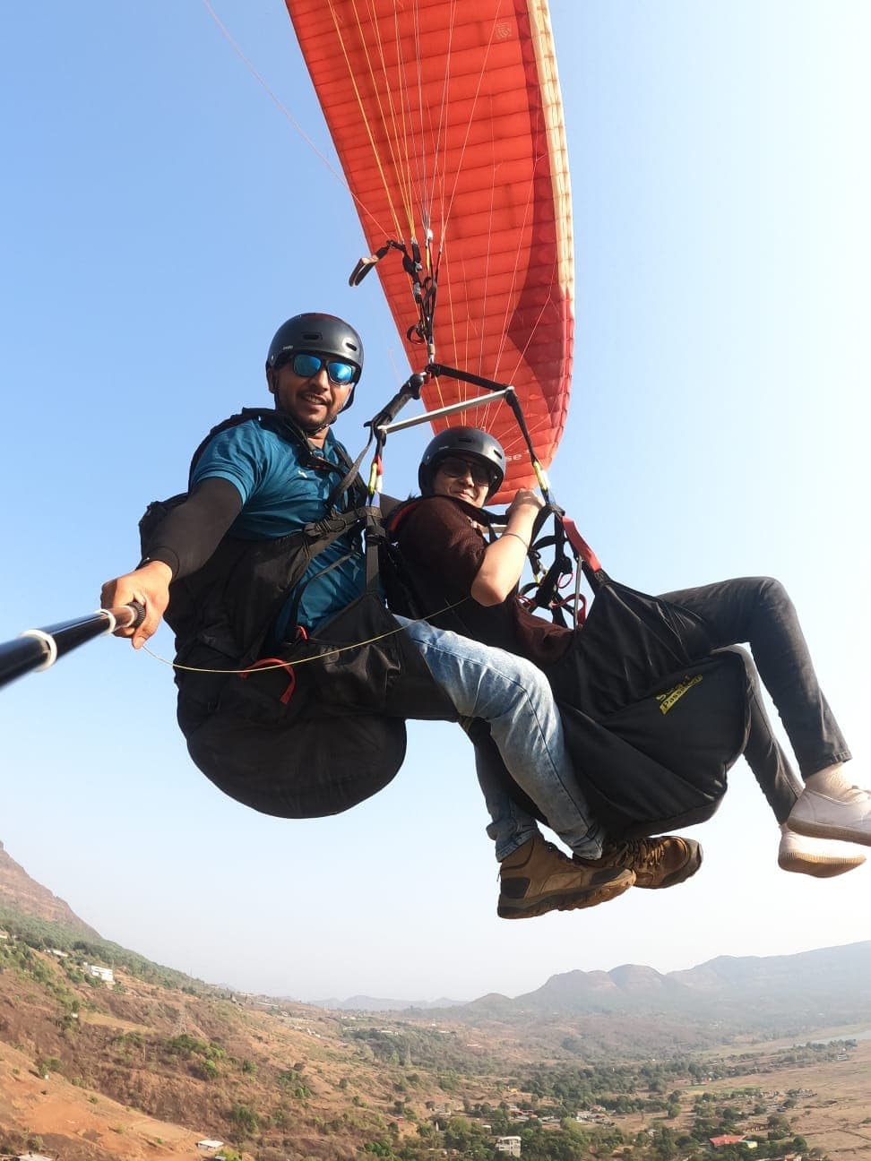 Paraglider soaring over Kamshet hills near Lonavala